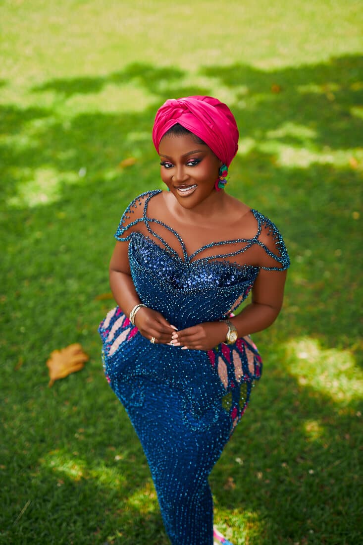 Blue beaded kente gown in the garden