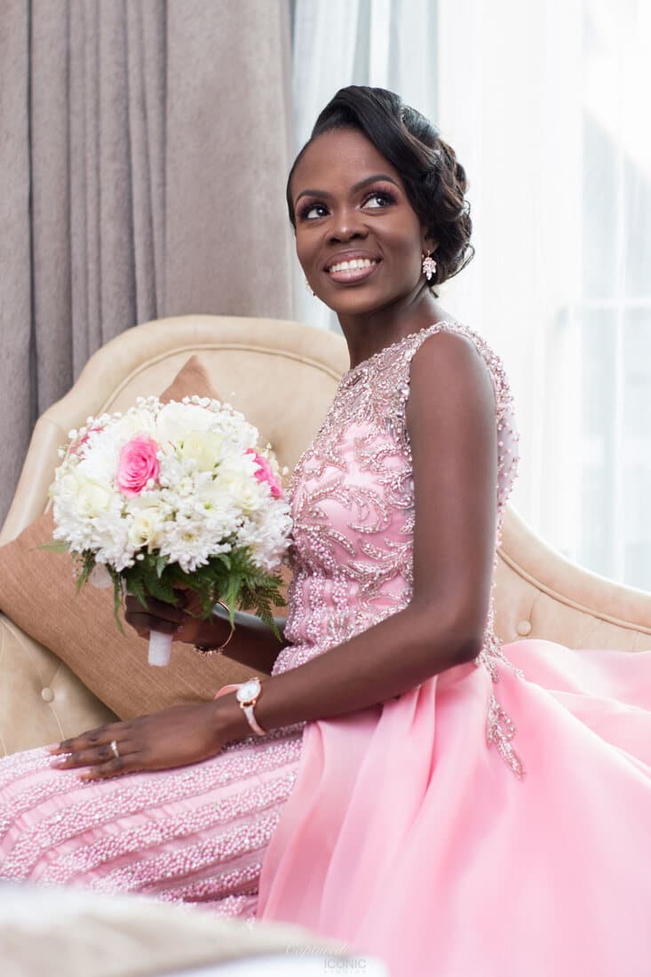 Bride in pink beaded gown with bouquet